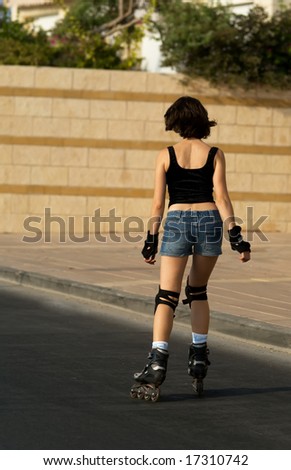 The young woman roller skating
