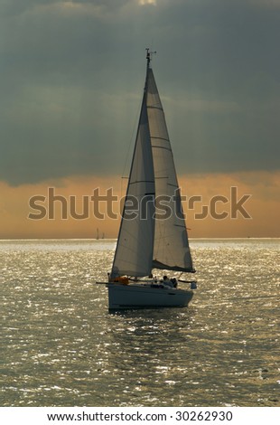 Small racing yacht at the sea