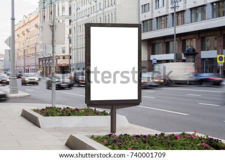 Blank mock up of vertical street poster billboard on city background