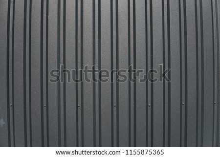 Brown metal plate. Siding. Seamless surface of galvanized steel. Industrial building wall made of corrugated metal sheet, flat background photo texture.