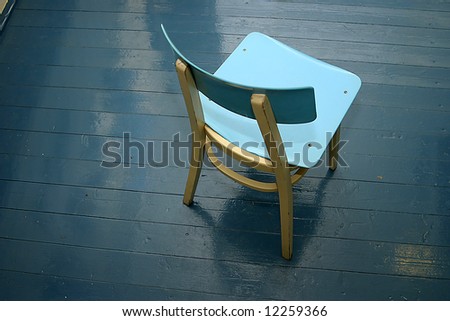 Old Blue chair on blue floor