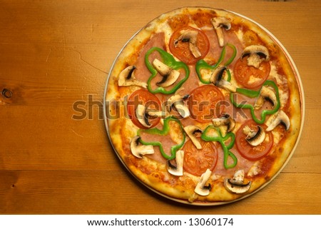 Fresh salami, mushrooms and vegetable pizza