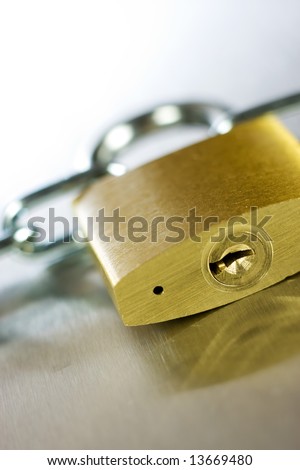 Strong Security Lock & Chain on a metal background
