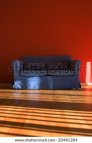 Red room with blue sofa