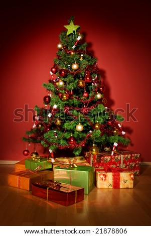 A christmas tree with a star and presents under tree