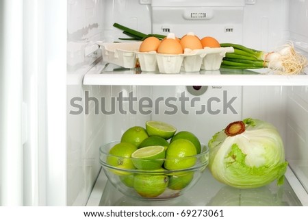 Open refrigerator full with some kinds of food