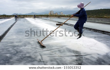 BA RIA, VIET NAM- FEBRUARY 3: Salt worker working on salina, they harvesting white salt in  Ba Ria, Viet Nam on February 4, 2013