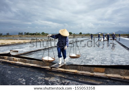 BA RIA, VIET NAM- FEBRUARY 3: Salt worker working on salina,they harvesting white salt in  Ba Ria, Viet Nam on February 4, 2013