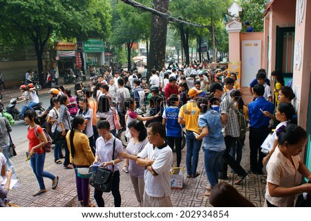HO CHI MINH CITY, VIETNAM- JULY 5: Pupil finish exam time in examination season to select university for future, crowd of examinee leave school, Vietnam, July 5, 20134