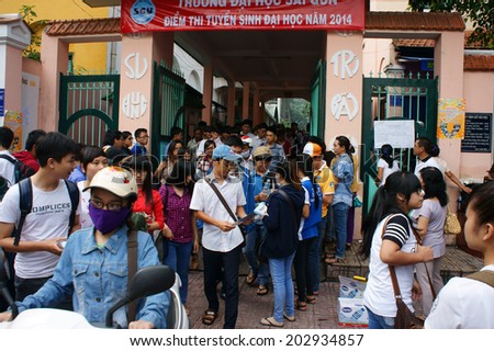 HO CHI MINH CITY, VIETNAM- JULY 5: Pupil finish exam time in examination season to select university for future, crowd of examinee leave school, Vietnam, July 5, 2014