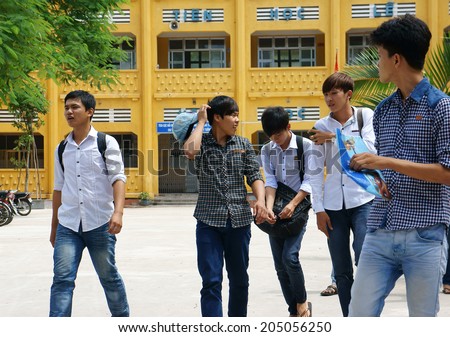 HO CHI MINH CITY, VIETNAM- JULY 15: Group of Vietnamese high school student finish university entrance exam, schoolboy walking in happy, this time is examination season in Viet Nam, July 15, 2014
