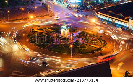HO CHI MINH CITY, VIETNAM- AUG 21: Impression scene of Asia traffic, dynamic, crowded city with trail of vehicle on street, Quach Thi Trang roundabout at Ben Thanh market, Vietnam, Aug 21,2014