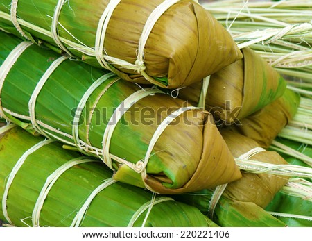 Banh tet for Lunar New Year, Vietnam Tet, food make from glutinous rice, meat, green bean, cover by banana leaf, tie by bamboo rope, is traditional Vietnamese dishes