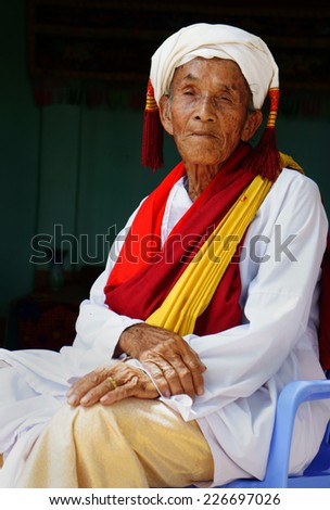 PHAN RANG, VIET NAM- OCT 22: Portrait of Vietnamese old man, senior male in tradition clothing of Cham people at Kate carnival, important festival of Cham Ba la mon, Oct 22, Vietnam, 2014
