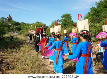 PHAN RANG, VIET NAM- OCT23: Amazing panoramic on Asian country road, crowd of Vietnamese in tradition clothing, pick up dress in Ka Te festival, traditional culture of Cham people, Vietnam, Oct23,2014