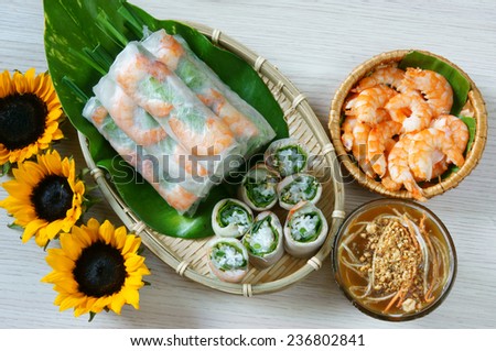 Vietnamese food, goi cuon is street food, roll that delicious, wrapped from shrimp, pork, vegetables, bun in rice paper, with accompaniments:  sauce, chili,  another name: salad roll, soft roll..