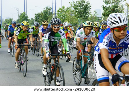 HO CHI MINH CITY, VIET NAM- JAN2: Amazing cycle race, sport activity to happy new year at Asia, rider wear helmet, ride bicycle in high speed, spirit, Vietnamese rider in action, Vietnam, Jan 2, 2014