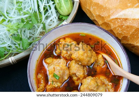 Vietnamese food, meatball, make from ground meat, delicious, popular street food or Vietnam meal, season with vegetable as: cucumber, scallion, papaya  and bread. This dish process by Dalat style