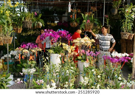 HO CHI MINH CITY, VIET NAM- FEB 9: Spring on Saigon street, outdoor market that show colorful flower on pavement, Tet also lunar New Year is traditional culture of Vietnamese, Vietnam, Feb 9, 2015
