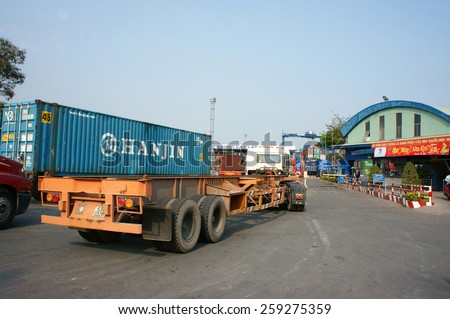 HO CHI MINH CITY, VIET NAM- FEB11: Transportation for export, import at Cat Lai port on Sai Gon river, crane load container to boat, this harbor is big industry service for trade, Vietnam, Feb 11,2015