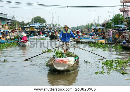 SOC TRANG, VIET NAM- MAR 23: Crowded atmosphere on Nga Nam floating market, group of rowing boat on river,panoramic of  trade activity on farmer market of Mekong Delta, Vietnam, Mar 23, 2015