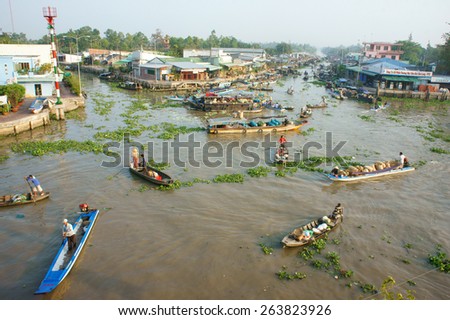 SOC TRANG, VIET NAM- MAR 23: Crowded atmosphere on Nga Nam floating market, group of rowing boat on river,panoramic of  trade activity on farmer market of Mekong Delta, Vietnam, Mar 23, 2015