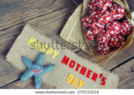 Happy mothers day with i love you mom message,  idea from colorful fabric starfish on wooden background, beautiful  flower,  abstract wooden texture, mother\'s day is  day for mom, love of family
