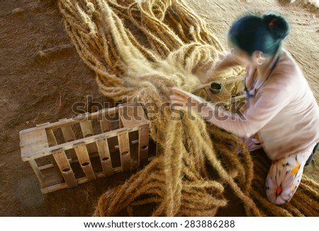 BEN TRE, VIET NAM- JUNE 1: Asian worker work inside coir mat workshop, Vietnamese woman work traditional craft, coconut matting to export, coconut fiber material at Mekong Delta, Vietnam, June 1, 2015