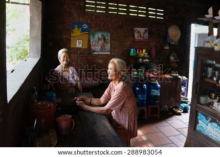 BEN TRE, VIET NAM- MAY 31: Two Asia old woman sitting and have fun in house, Vietnamese elderly happy with friendship, healthy lifestyle make expectation of life, BenTre, Vietnam, May 31, 2015