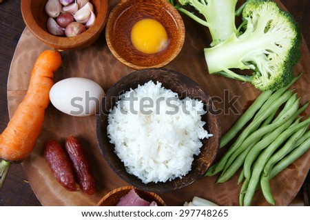 Vietnamese food, fried rice, a delicious Asian eating, raw material as carrot, cooked rice, meat, egg, sausage, onion, garlic, this meal rich cholesterol, calories