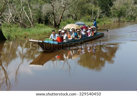AN GIANG, VIET NAM- OCT 17: Group of traveler traveling nature landscape at Chau Doc, Mekong Delta, Tra Su indigo forest, crowded of people on row boat, make ecotourism, Angiang, Vietnam, Oct 17,2015