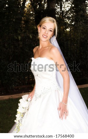 Beautiful Blond bride wearing diamond jewelery on her wedding day