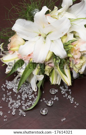 Pastel Wedding Flower arrangement amongst glass stones
