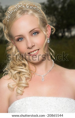 Beautiful Blond bride wearing diamond jewelery