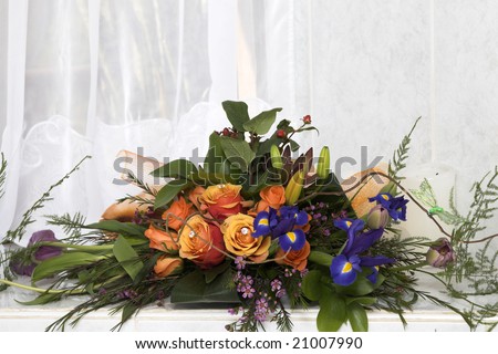 stock photo Wedding Table flower arrangement with orange roses