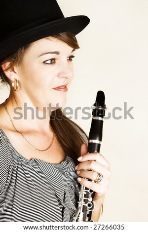 Beautiful female musician posing with her flute