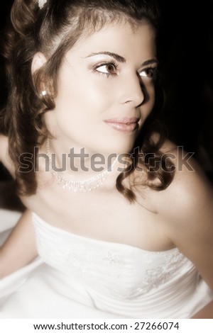 Beautiful brunette bride wearing diamond jewelery