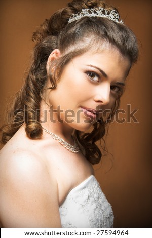 Beautiful brunette bride wearing diamond jewelery