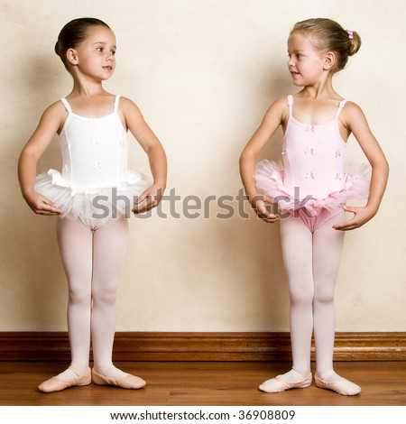 stock-photo-young-ballet-dancer-in-a-studio-with-wooden-floors-36908809.jpg