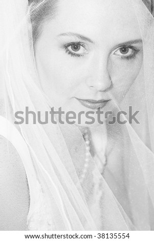Beautiful blond bride wearing a pearl necklace