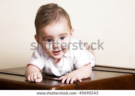 stock photo Beautiful brunette baby girl with cute facial expressions