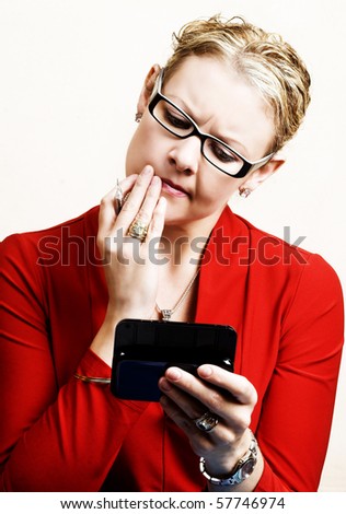 Business woman trying to figure out the message on her phone
