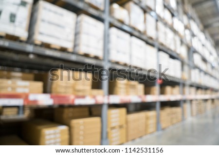 Blurred image of stock inventory shelf, modern logistics warehouse management of wholesale or distributor background concept.