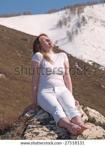 woman breathes in cool air