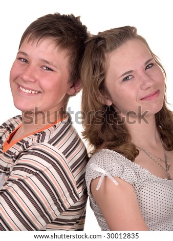 stock photo two cute teenagers stand back to one another