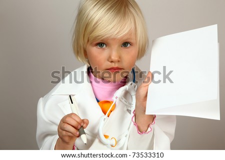 cute girl plays in doctor with prescription