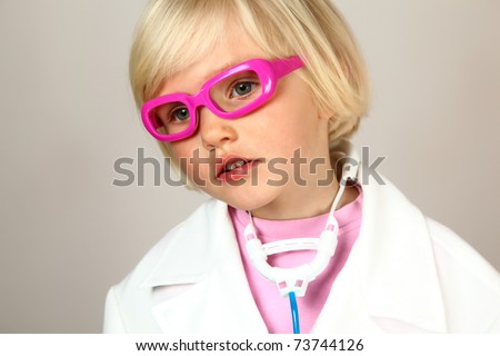 cute girl plays in doctor with prescription