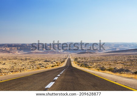 Beautiful road in the desert, going beyond the horizon. Israel