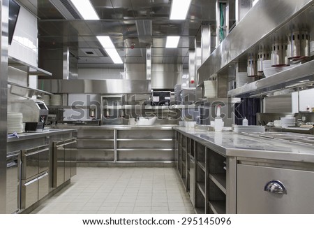 Professional kitchen , view counter in stainless steel . Bokeh .