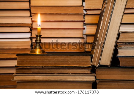 candle and books. composition
